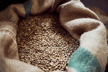 Burlap sack with fresh arabica coffee beans