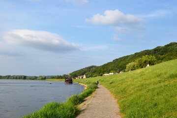 Obraz premium Kazimierz Dolny, Poland. Promenade on the banks of Vistula river. Popular place for tourists