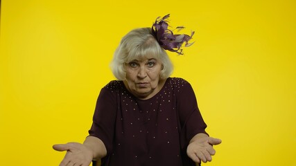 Irritated senior old woman raising hands, indignantly asking reason of failure, asking what, why