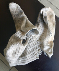 old dirty torn woolen socks