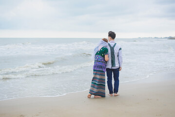 man walking on the beach