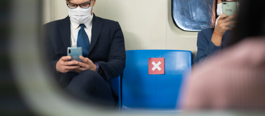 Asian young business man Passengers On public transport. Face Mask protection against virus. Covid-19, coronavirus pandemic