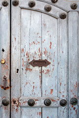 Aged wooden door with slot for letters with writing Letters in Spanish, Antigua Guatemala