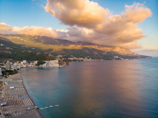 Top view of the beach in the resort town Becici, Budva, Montenegro. Drone aerial shot