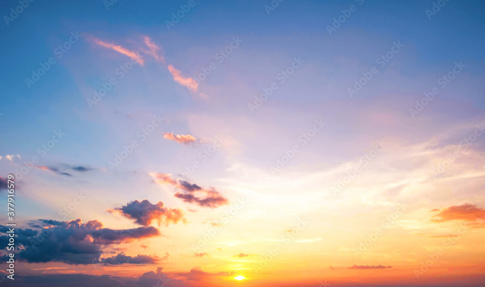 Wall mural background of colorful sky concept: dramatic sunset with twilight color sky and clouds