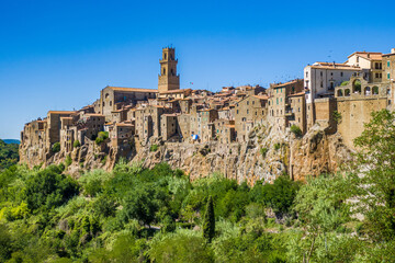 Fototapeta na wymiar Pitigliano, Tuscany perched on tuff cliff, Old Town and alleys. Splendid town in the Tufo Area, in the heart of Tuscan Maremma, Pitigliano perched on tuff cliff one of most beautiful villages in Italy