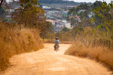 A motorcycle travel in a smal city