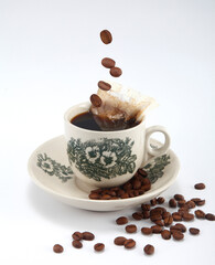 Kopi is a type of traditional coffee local to Singapore and Malaysia. It is a highly caffeinated black coffee served with milk and sugar.