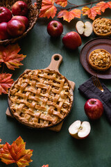 Autumn apple pie. Traditional american apple pie with fresh apples and cinnamon. Top view, copy space. Classic autumn Thanksgiving pastry dessert
