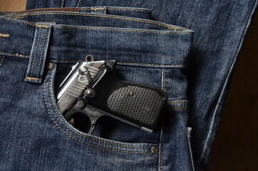 Gun in woman Jeans pocket, dangerous for many reasons