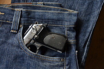 Gun in woman Jeans pocket, dangerous for many reasons