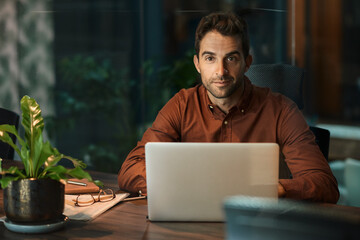Businessman working late at his desk in an office