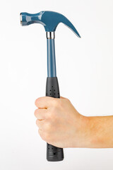A man's hand holding a hammer is isolated on a white background