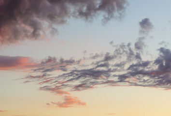 clouds at sunset against evening sky color gradient