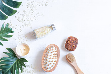 Spa composition with body care items and leaves.