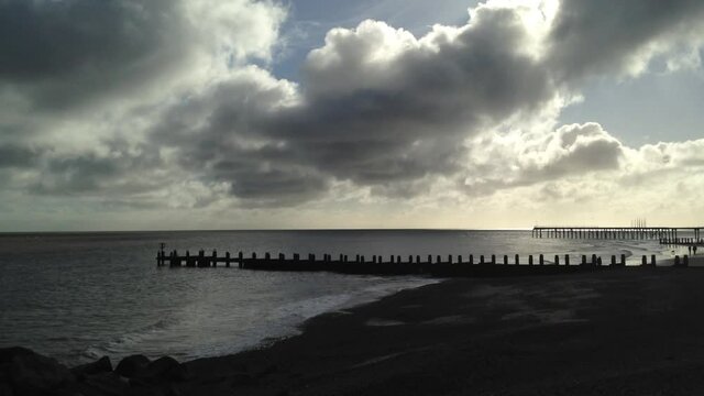 Empty beach at sunset on the English coast