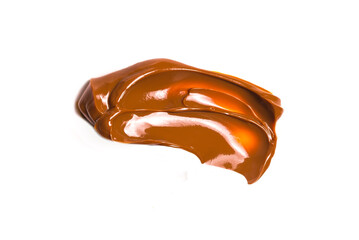Melted tasty caramel splashes isolated on white background.