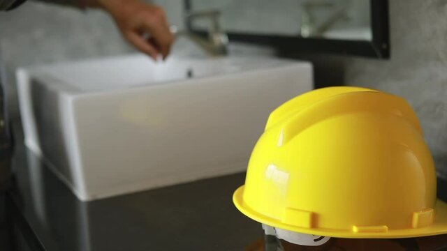 Construction workers washing hands, hygiene concept