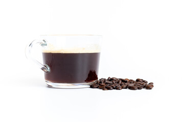 A glass of coffee grinder with coffee beans on white background