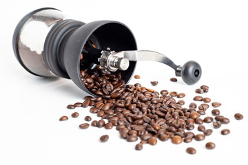 coffee grinder with coffee beans on white background