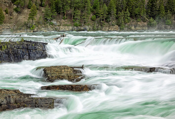 Original outdoor photograph of cascading Kootenai Falls in Western Montana