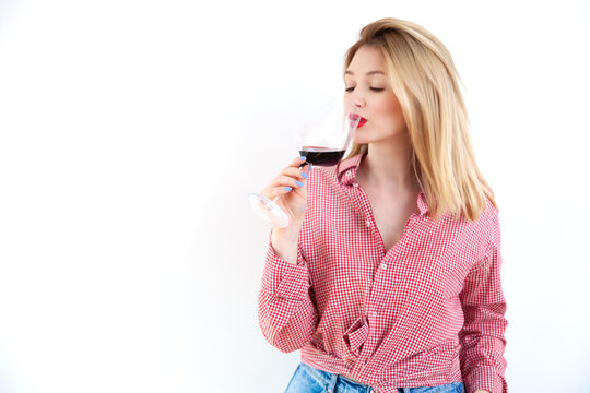 Young Beautiful Woman Holding Red Wine Glass On White Background