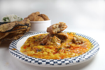 Traditional Rajasthani food Daal Bati Churma.made with wheat flour and served with tadke wali dal.