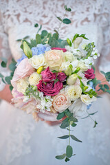 Bride holds a wedding bouquet, wedding dress, wedding details