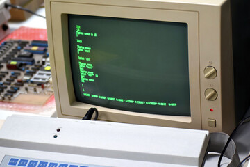 Old 8-bit personal computer green monochrome monitor screen