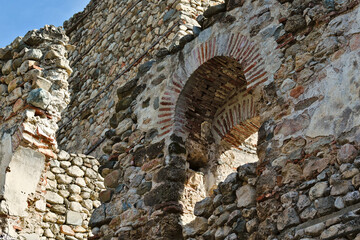 Stone wall and window at medieval Byzantine fortress, town of Melnik, Bulgaria