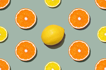 Top view of fresh lemon and orange seamless pattern on gray or olive background. Many sliced yellow lemon, one full and orange seamless texture background. Fruit minimal concept.