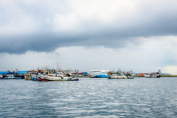 Fototapeta na wymiar Fishing ships in the port near the city of Male, Maldives