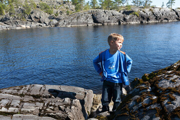 Fototapeta premium Kid on island in Ladoga skerries