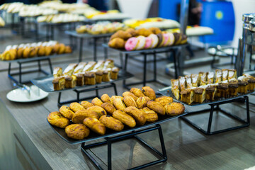 croissants and other sweets on the buffet table during the coffee break