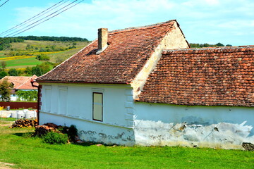 Typical rural landscape and peasant houses in  the village Cincsor, Kleinschenk, Transylvania,...