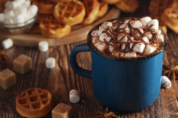 A mug with hot chocolate with marshmallow	
