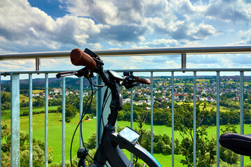 Bicycle hitched to the railing of a viewing platform of a skywalk in Sauerland, Germany, during a...