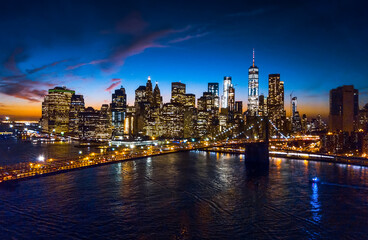 Aerial view of Brooklyn bridge and skyline at night