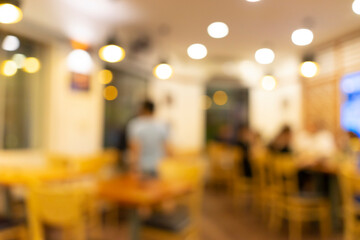 Fototapeta na wymiar Blurred background of Vietnamese restaurant with people.