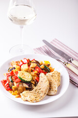 Grilled vegetables and fried chicken breast