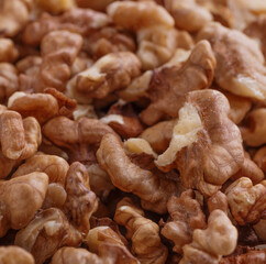 Walnuts shelled. Peeled Raw Walnuts. Fresh organic Nuts. Raw nuts. Many delicious Walnuts as a food background.