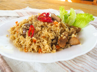 plate with pilaf, hot pepper and herbs. national cuisine. Oriental food.
