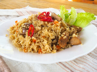 plate with pilaf, hot pepper and herbs. national cuisine. Oriental food.