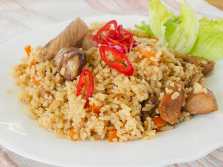 plate with pilaf, hot pepper and herbs. national cuisine. Oriental food.