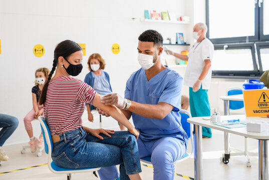 Woman With Face Mask Getting Vaccinated, Coronavirus, Covid-19 And Vaccination Concept.