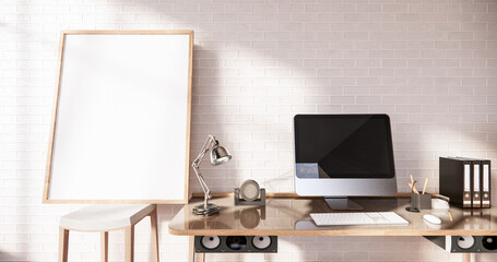 Computer and office tools on desk in room interior loft style with white brick wall on wooden floor.3D rendering