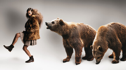 woman walking in fur coat with two bears