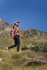 Young South American Girl Hiking in the Alpine Meadows. Connection with Nature and Solo Traveling