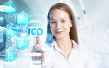 Business, Technology, Internet and network concept. Young businessman working on a virtual screen of the future and sees the inscription: ICO
