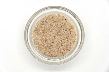 psyllium seeds in a transparent bowl, detailed view in a photo box